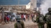 Protesters shout at police as they demonstrate in the Kibera slum of Nairobi, Kenya, March 20, 2023.