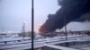 Asap mengepul setelah drone SBU Ukraina menyerang kilang minyak Rusiawilayah Ryazan, Rusia, dalam tangkapan layar dari video yang diperoleh Reuters, 13 Maret 2024.