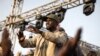 Le chef de l'opposition Ousmane Sonko (C) salue ses partisans lors d'un meeting de l'opposition deux jours avant son procès, à Dakar, le 14 mars 2023.