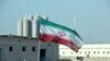 Bendera Iran tampak berkibar di lokasi pembangkit Listrik Tenaga Nuklir (PLTN) Bushehr dalam foto yang diambil pada 10 November 2019. (Foto: AFP/Atta Kenare)