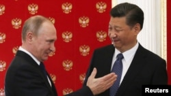 资料照：中国领导人习近平与俄罗斯总统普京会面。