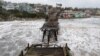 This aerial view shows a damaged pier is split in Capitola, California, Jan. 9, 2023.