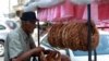 A street vendor arranges 'Kaak' a Lebanese street bread in the southern Lebanese city of Sidon, Sept. 6, 2022. 