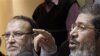 Senior members of Egypt's Muslim Brotherhood Mohamed Morsi, right, and Essam el-Erian hold a press conference on the latest situation in Egypt in Cairo, Egypt, Wednesday, Feb. 9, 2011. (AP Photo/ Mohammed Abou Zaid)