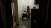 FILE - Anas al-Sarrari moves around in his wheelchair in his home in Marib, Yemen, July 29, 2018. He says he was hung by his wrists from the ceiling for 60 days and beaten while locked up in a prison run by Yemen’s Houthi rebels.