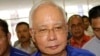 前馬來西亞總理辭去政黨領導人職務 被禁離境 