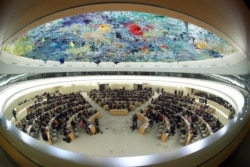 FILE - Overview of the session of the Human Rights Council during the speech of U.N. High Commissioner for Human Rights Michelle Bachelet at the United Nations in Geneva, Switzerland, Feb. 27, 2020. Picture taken with a fisheye lens.