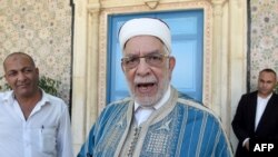 FILE - First Vice President of the Assembly Abdel Fattah Mourou (C) arrives to attend the swearing-in ceremony of Tunisia's parliamentary speaker Mohamed Ennaceur as interim president, July 25, 2019. 