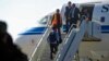 A Yemeni rebel delegation prepares to fly on a Kuwaiti plane accompanied by a U.N. peace envoy, heading for talks in Sweden with the government aimed at ending the country's devastating war, Dec. 4, 2018, in Sanaa.