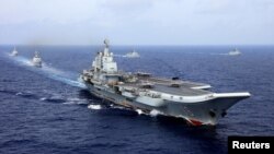 2018年4月18日，中國航母遼寧號參加中國海軍在西太平洋的軍事演習。