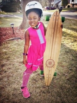 Monique Pederson poses with her skateboard. (Courtesy - Steve Pederson)