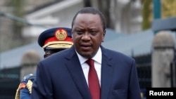 FILE - Kenya's President Uhuru Kenyatta arrives to inspect a guard of honor before the annual State of the Nation address at the parliament buildings in Nairobi, Kenya, May 2, 2018.