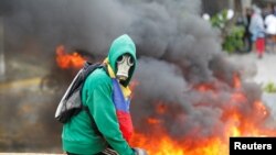 Cenário de protestos em Caracas, Venezuela. 