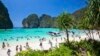 FILE - Tourists enjoy the popular Maya bay on Phi Phi island, Krabi province, March 4, 2017.