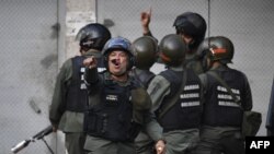 Des membres de la Garde nationale bolivarienne l à Cotiza, à Caracas (Venezuela), le 21 janvier 2018.