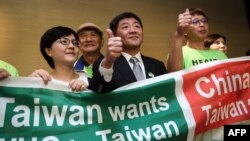 台灣衛生福利部部長陳時中（中）率團到日內瓦在世界衛生大會的場外發聲。（法新社2018年5月21日）