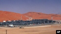 FILE - An industrial plant strips natural gas from freshly pumped crude oil is seen at Saudi Aramco's Shaybah oil field at Shaybah in Saudi Arabia's Rub al-Khali desert.
