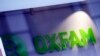 FILE - An Oxfam logo is seen on one of the organization's bookshops in Glasgow, Scotland, Feb. 10, 2018.