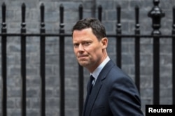 FILE PHOTO: British MP Alex Chalk walks outside Downing Street in London
