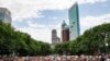 People gather for a memorial service for George Floyd at Cadman Plaza Park in the Brooklyn borough of New York, on June 4, 2020. 