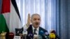 FILE - Palestinian Prime Minister Mohammed Shtayyeh chairs a cabinet meeting in the Jordan Valley village of Fasayil, Sept. 16, 2019. 