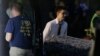 Police forensic investigators work at the crime scene of a mass shooting, as bodies are removed at the Pulse gay night club in Orlando, Florida, June 12, 2016.