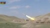 A still image from a video released by Azerbaijan's Defence Ministry shows a multiple rocket launcher of the Azeri armed forces performing strikes during clashes over the breakaway region of Nagorno-Karabakh in Azerbaijan, Sept. 30, 2020.