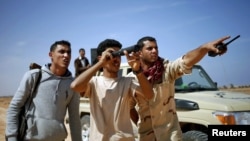 Des combattants libyens à Syrte, en mars 2015.