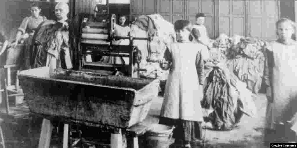 Magdalen Laundry Scene.&nbsp; Note girl with shaved head (L).&nbsp; Heads were often shaved upon entry to laundry or as punishment