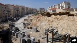 FILE- In this March 14, 2011, file photo, a general view of a construction site in the West Bank Jewish settlement of Modiin Illit. Israel approved the construction of 3,000 homes in Jewish settlements in the West Bank and east Jerusalem, a government of
