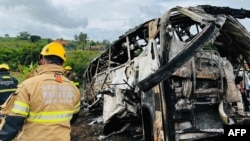 A photo released by the Minas Gerais Fire Department shows firefighters and other rescue teams working on the site of a crash in Teofilo Otoni, Minas Gerais state, Brazil, on Dec. 21, 2024.