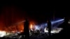 Firefighters make a stand in the backyard of a home in front of the advancing CZU August Lightning Complex Fire on Aug. 21, 2020, in Boulder Creek, Calif. 
