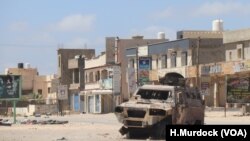 A burnt-out vehicle is left behind after a recent battle in a once-crowded suburb of Tripoli, Libya, April 28, 2019.