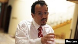 Ali al-Ekry, former senior surgeon at the Salmaniya hospital in Manama, speaks to the media after hearing the verdict in his trial, in which Bahrain's highest court upheld his jail term, in Manama, October 1, 2012. 