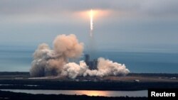 A SpaceX Falcon 9 rocket disappears into clouds after it lifted off on a supply mission to the International Space Station from historic launch pad 39A at the Kennedy Space Center in Cape Canaveral, Florida, U.S., February 19, 2017.